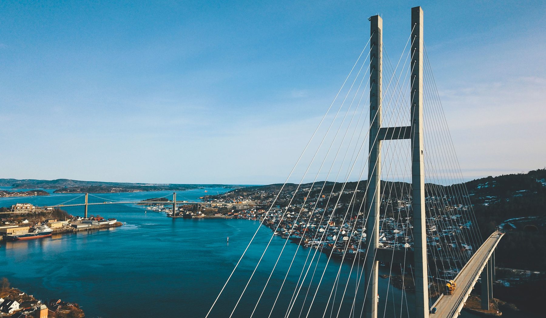 Modern bridge over water, representing connection and operational stability